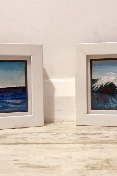 Pair of framed painted sea views