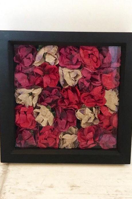 Red roses in a black box frame